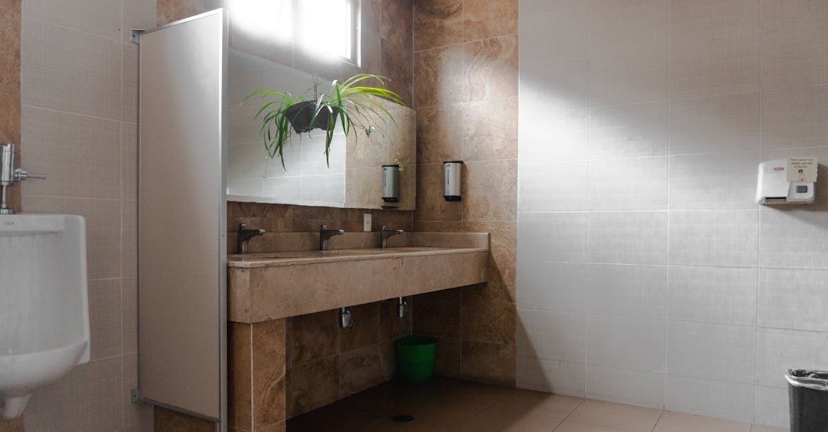 A bathroom with two sinks and a mirror.