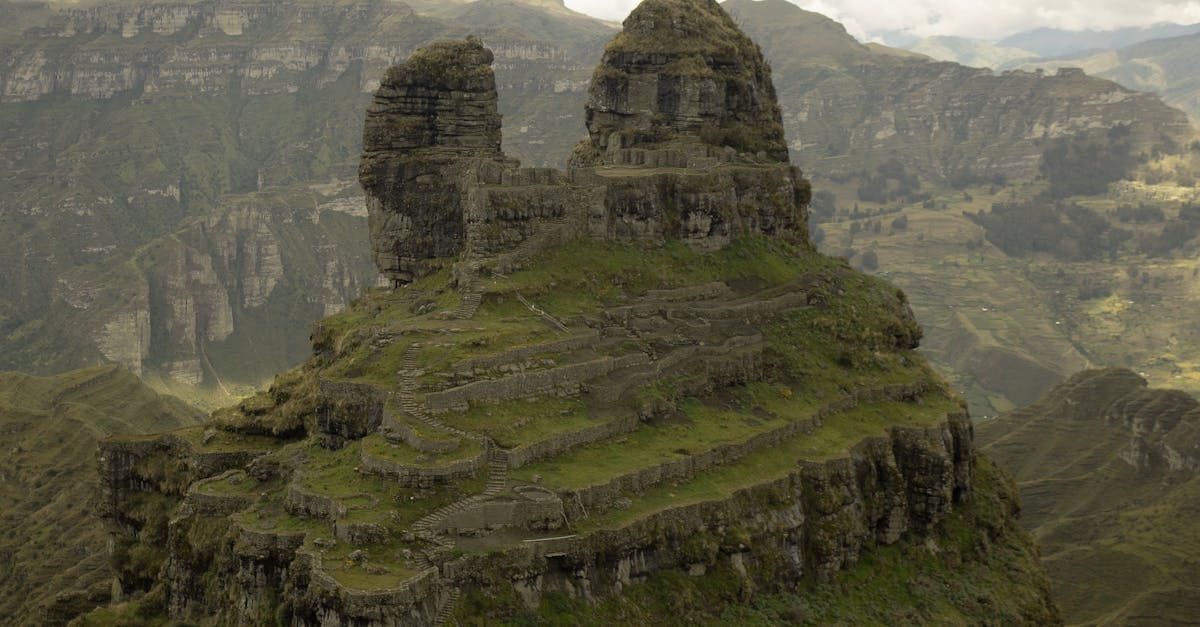 A large rock formation in the middle of a mountain.