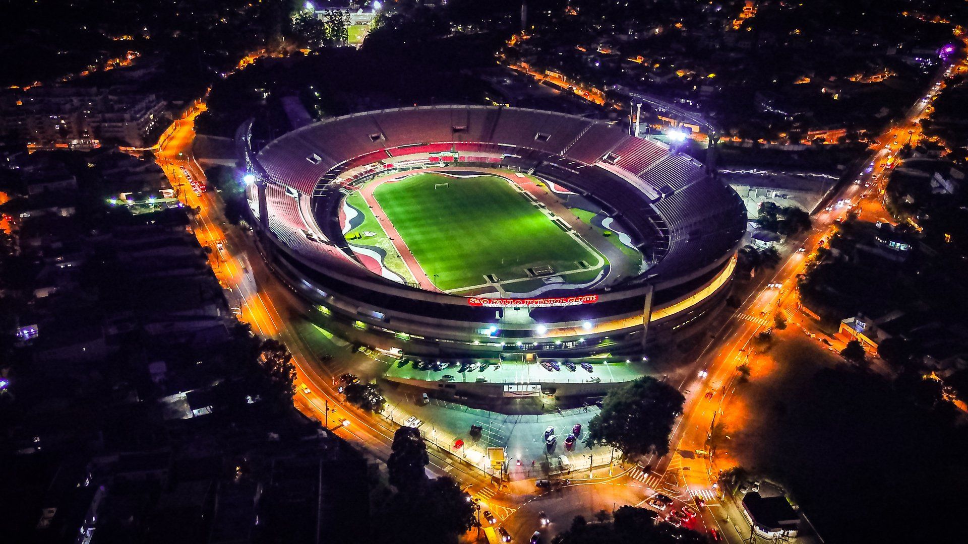 An aerial view of a soccer stadium at night.