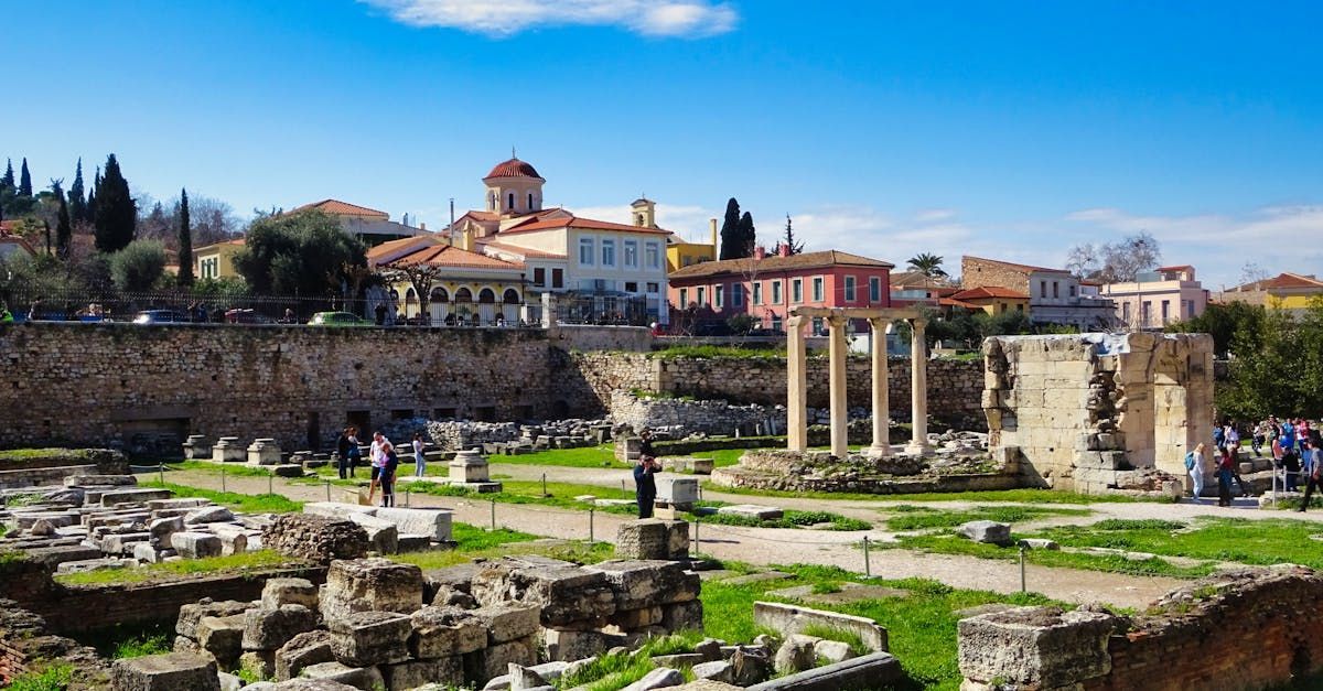 A group of people are walking through a ruined city.