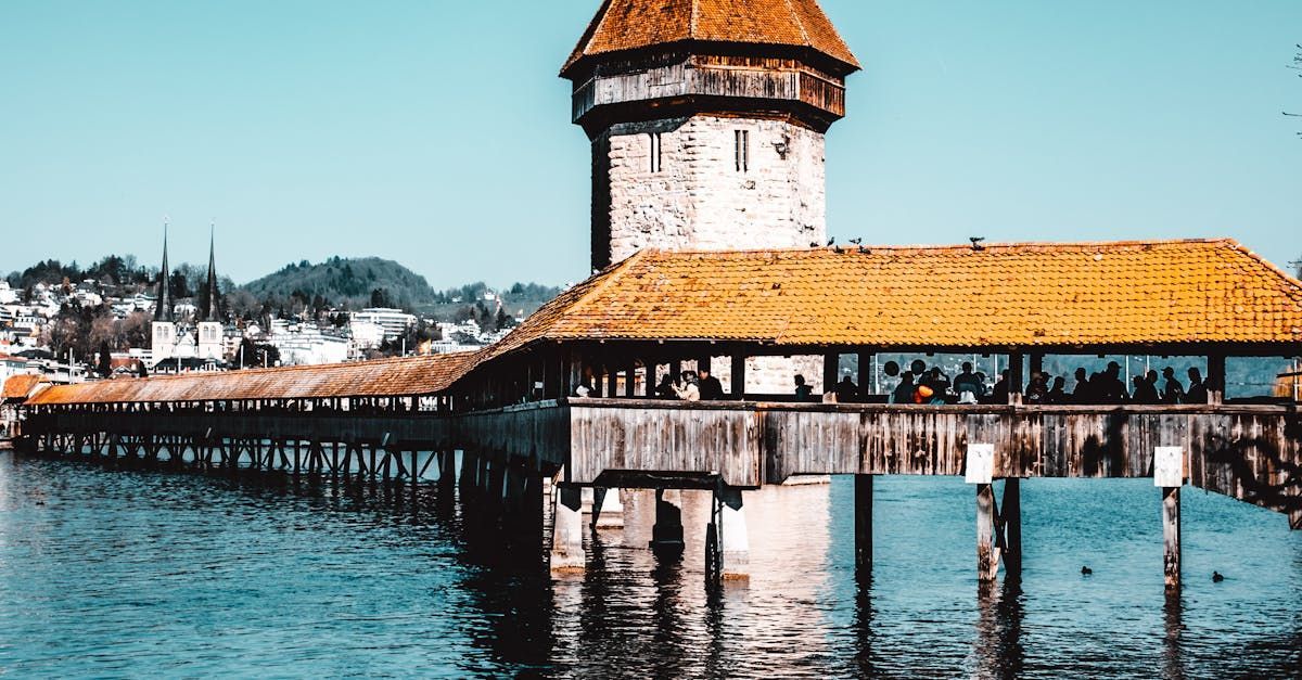 A bridge over a body of water with a tower on top of it.