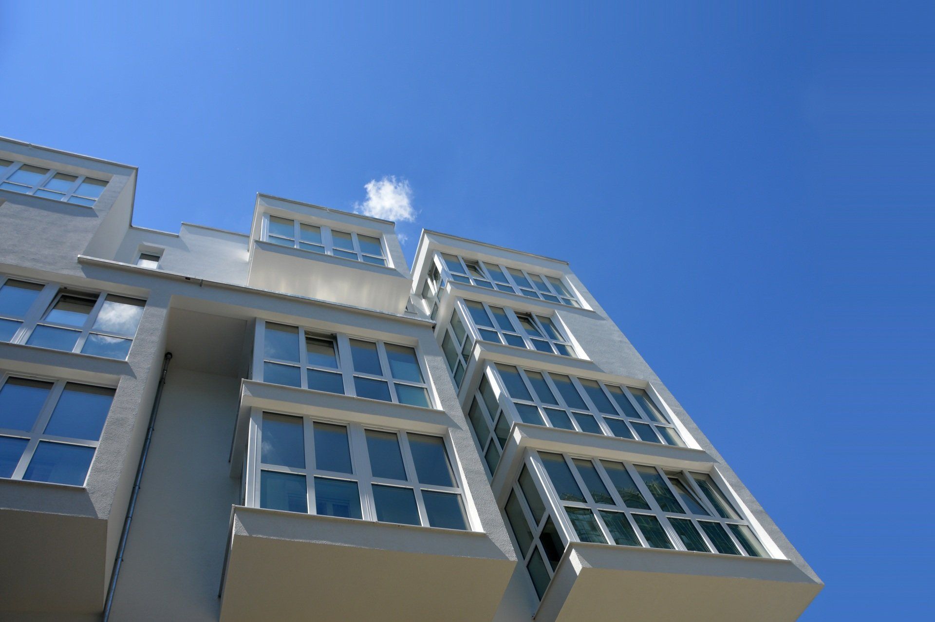 Looking up at a building with a blue sky in the background