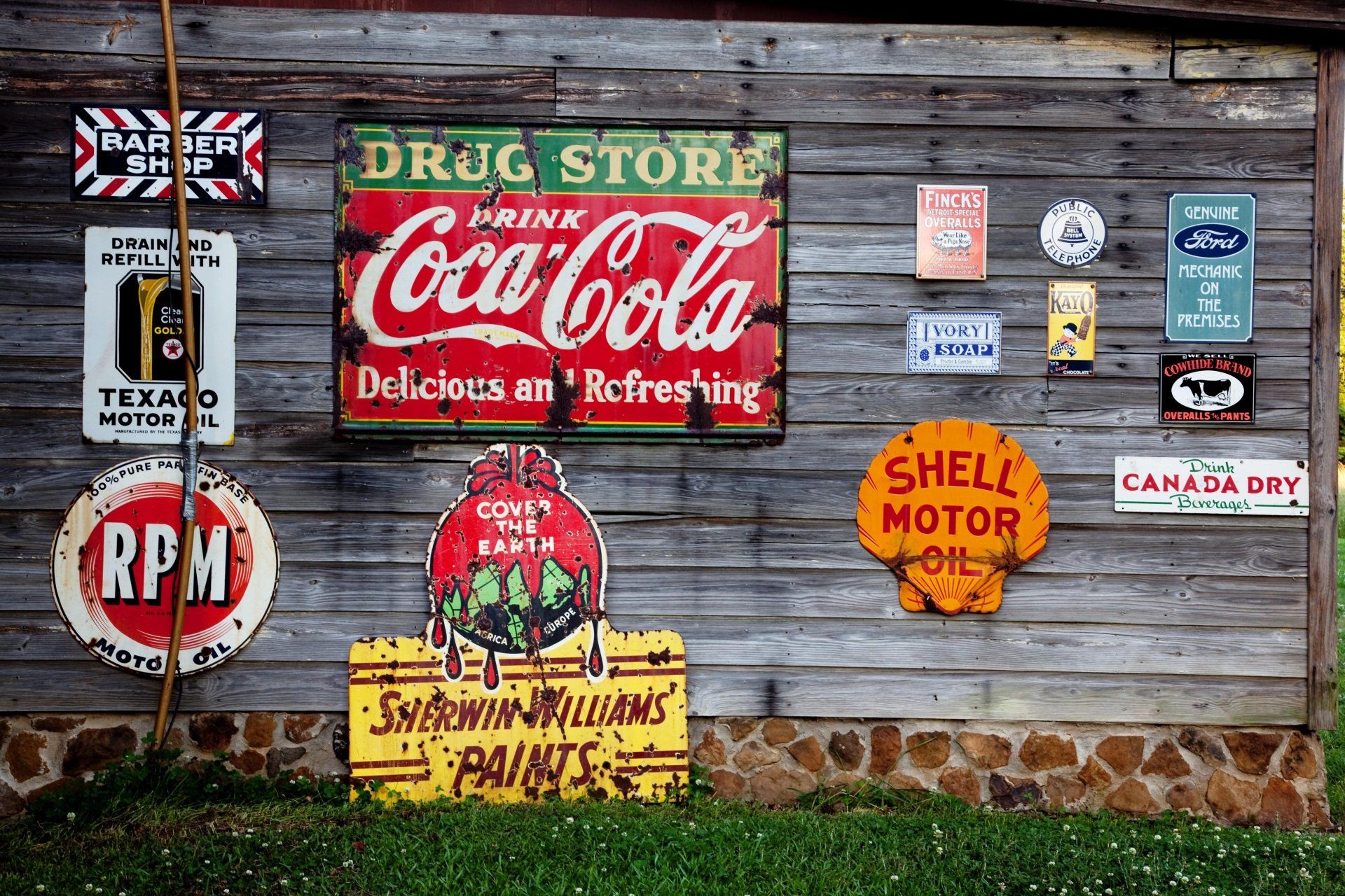 a wall with a coca cola sign on it