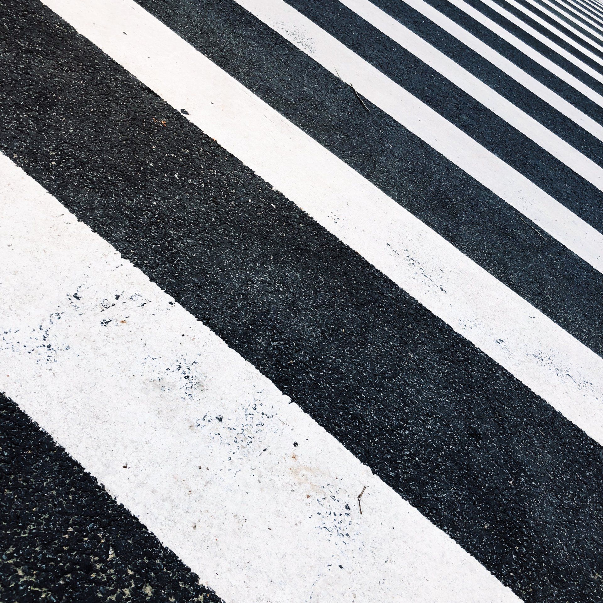 A black and white striped road with a diagonal pattern
