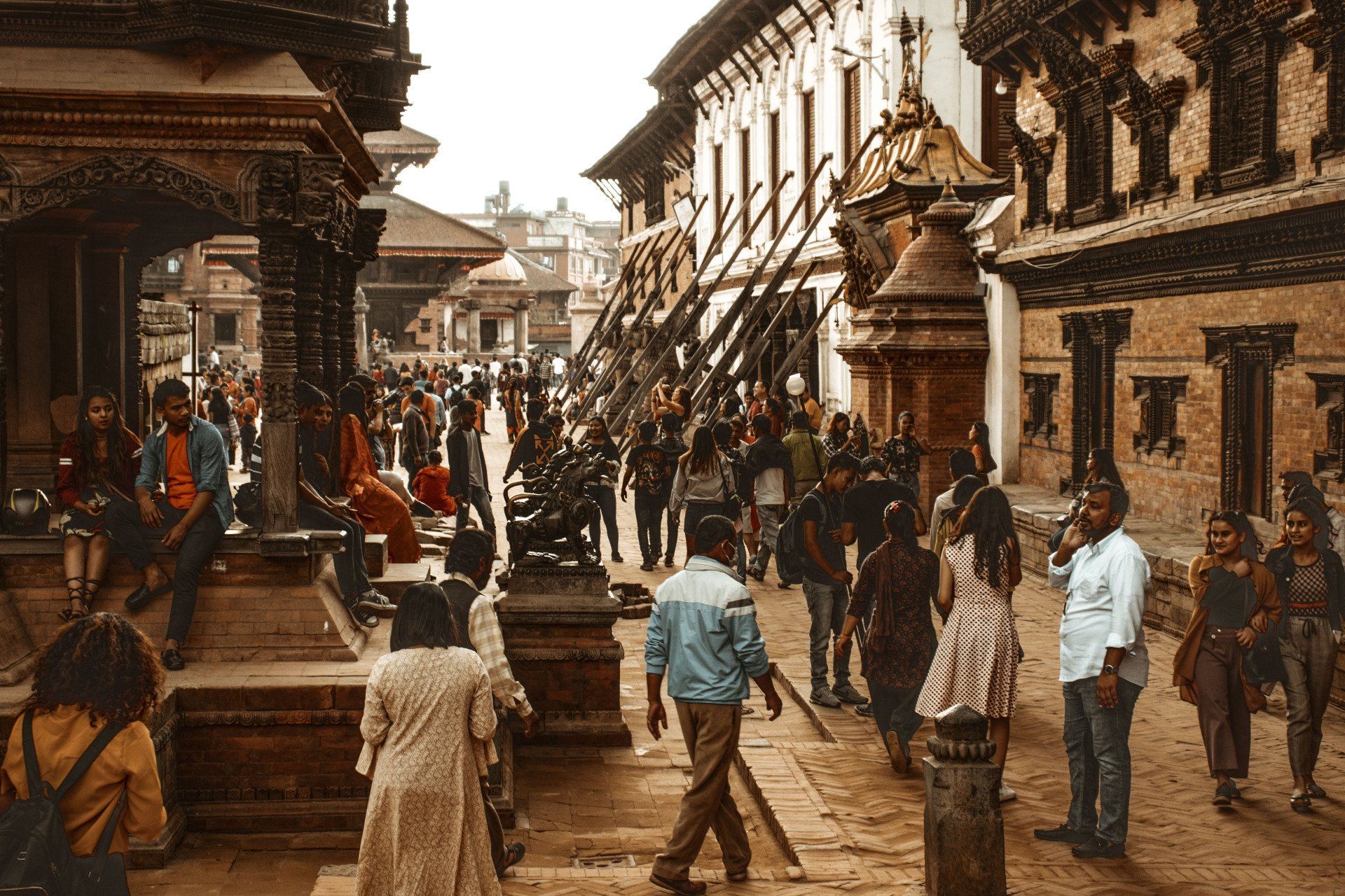 A group of people are walking down a busy street.