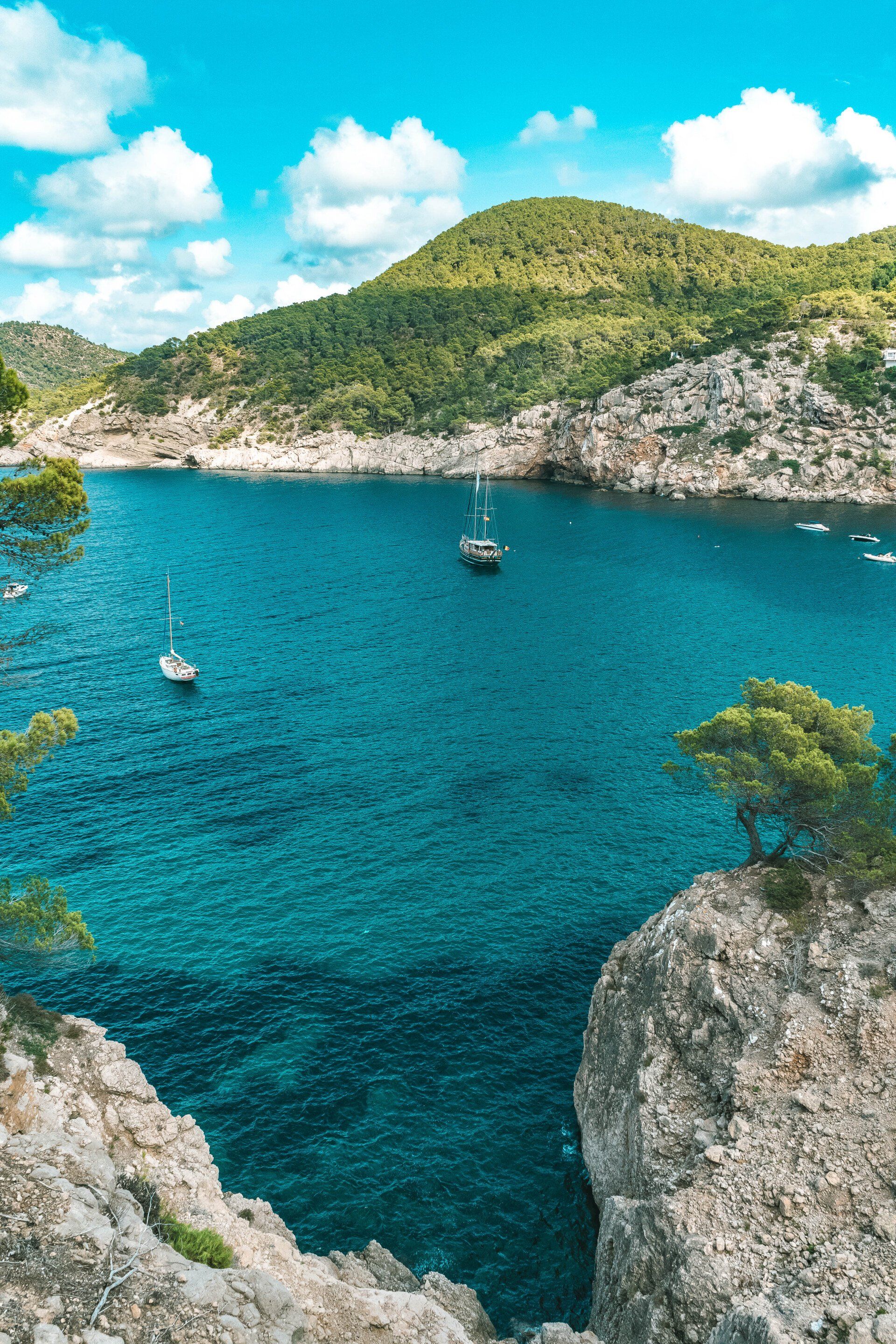 Beautiful Coastal View of the Blue Ocean with 2 Boats in Ibiza, Spain - Ibiza Holidays Barter's Travelnet
