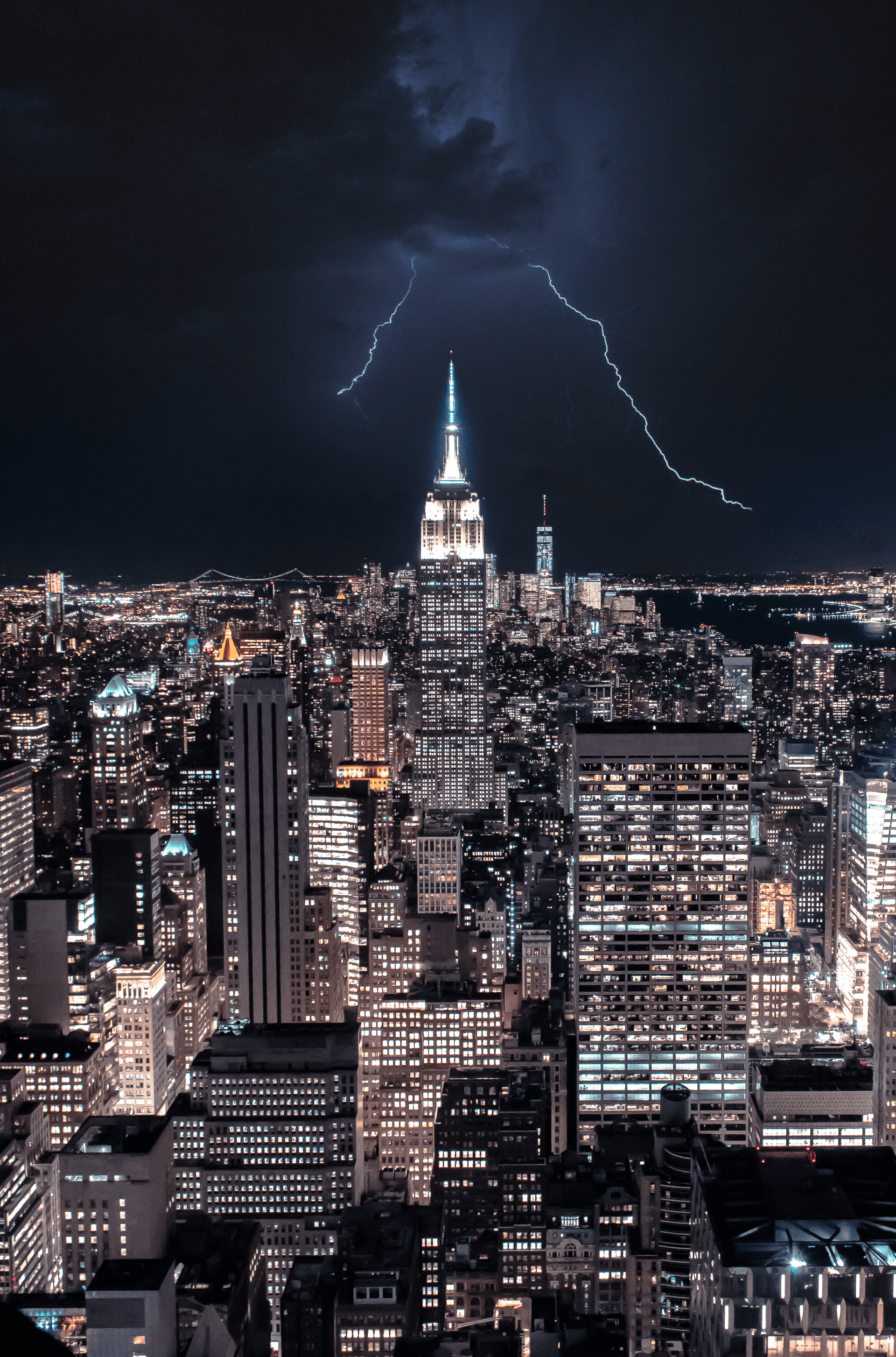 Lightning strikes over the empire state building in new york city