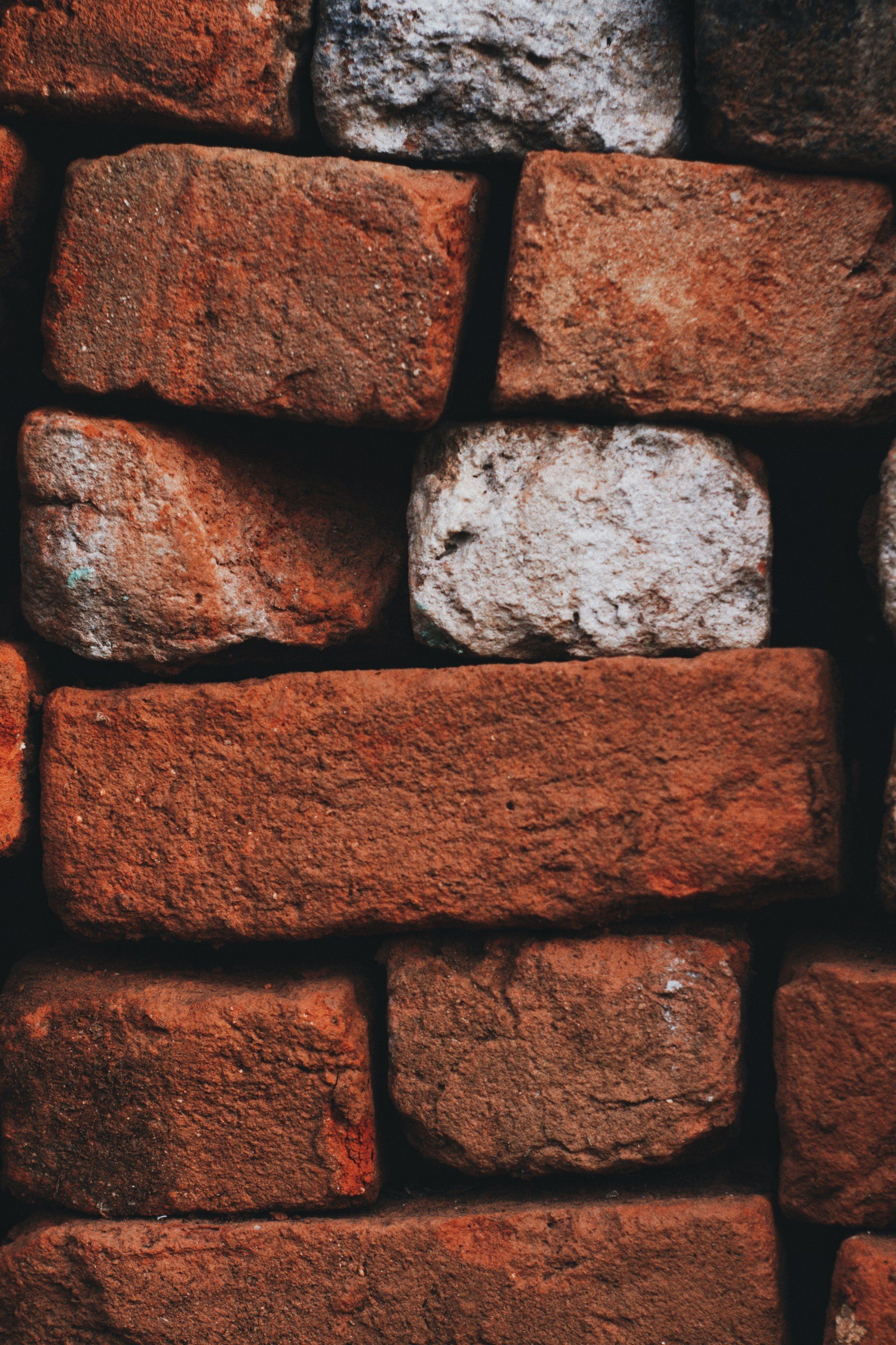 masonry stones and bricks that are red and white