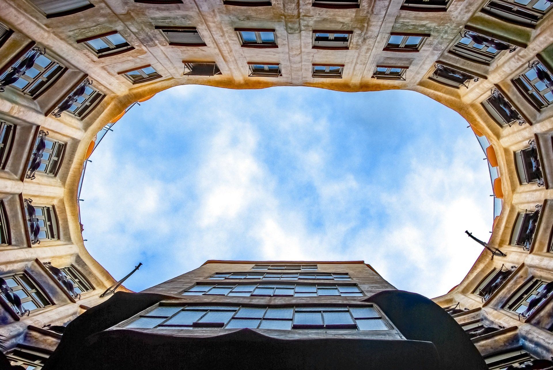 Looking up at a building with a blue sky in the background