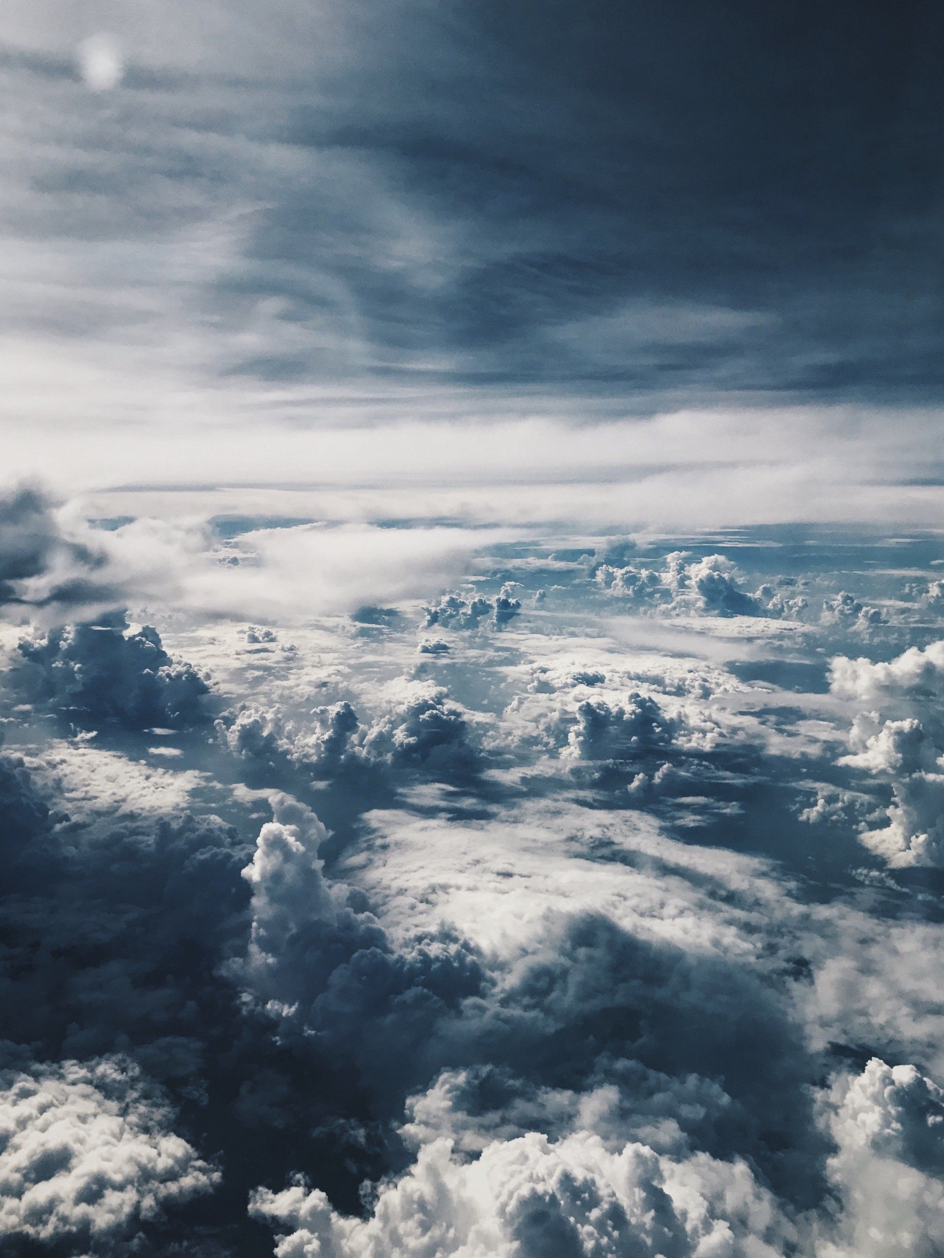 an aerial view of a cloudy sky from an airplane window