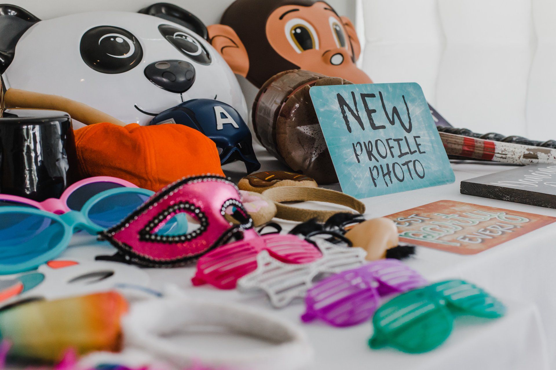 A table full of signs, masks, and other fun props included with photo booth rental service