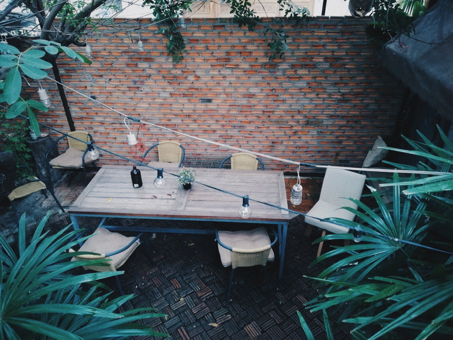 table and chairs in backyard oasis