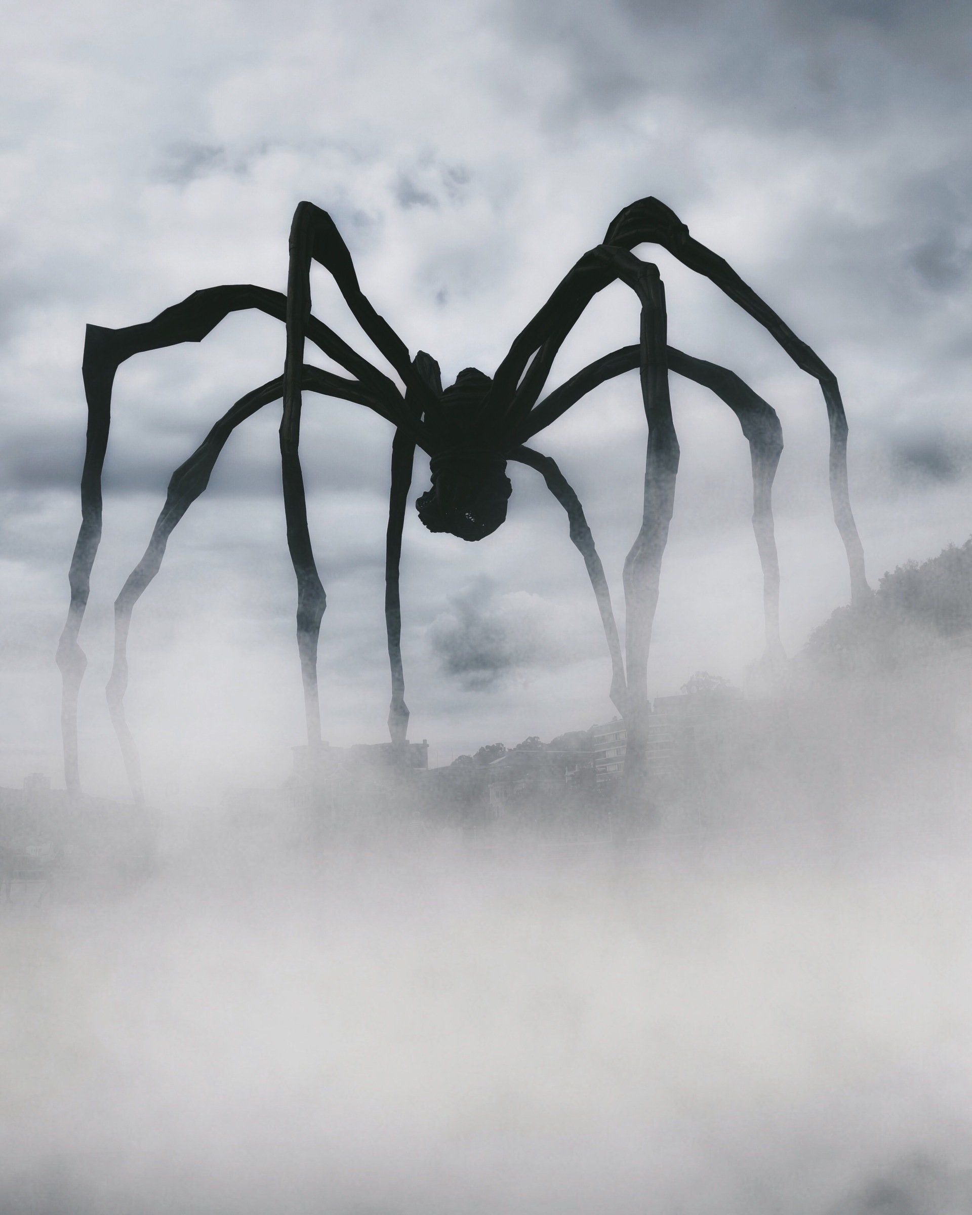 a giant spider is silhouetted against a cloudy sky