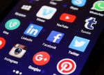 Phone screen with apps displayed.