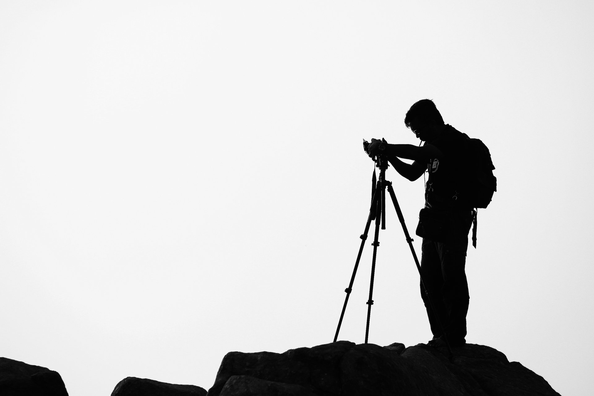 Silouette of a male photographer with tripod