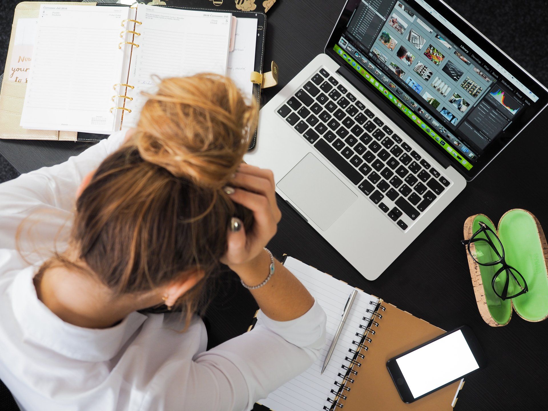 woman worrying at her desk (Faith and Trust in God's Plan When Life is Hard)