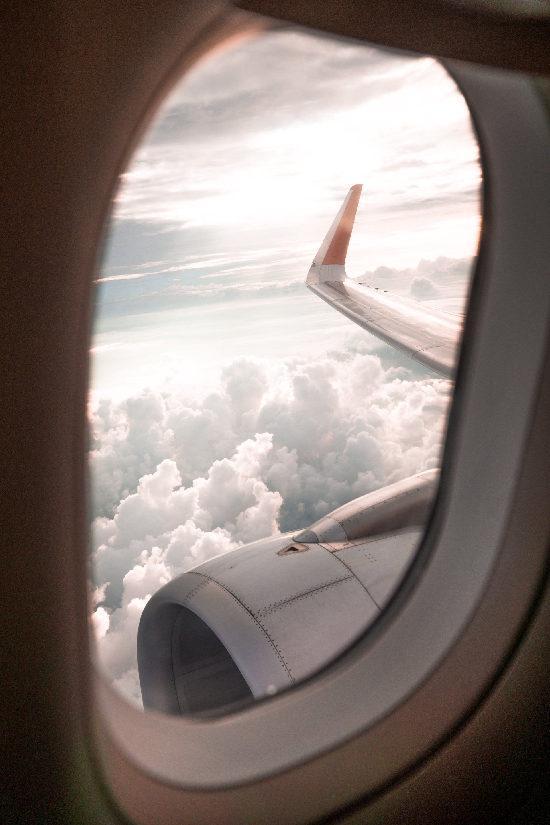 The wing of an airplane is visible through the window.