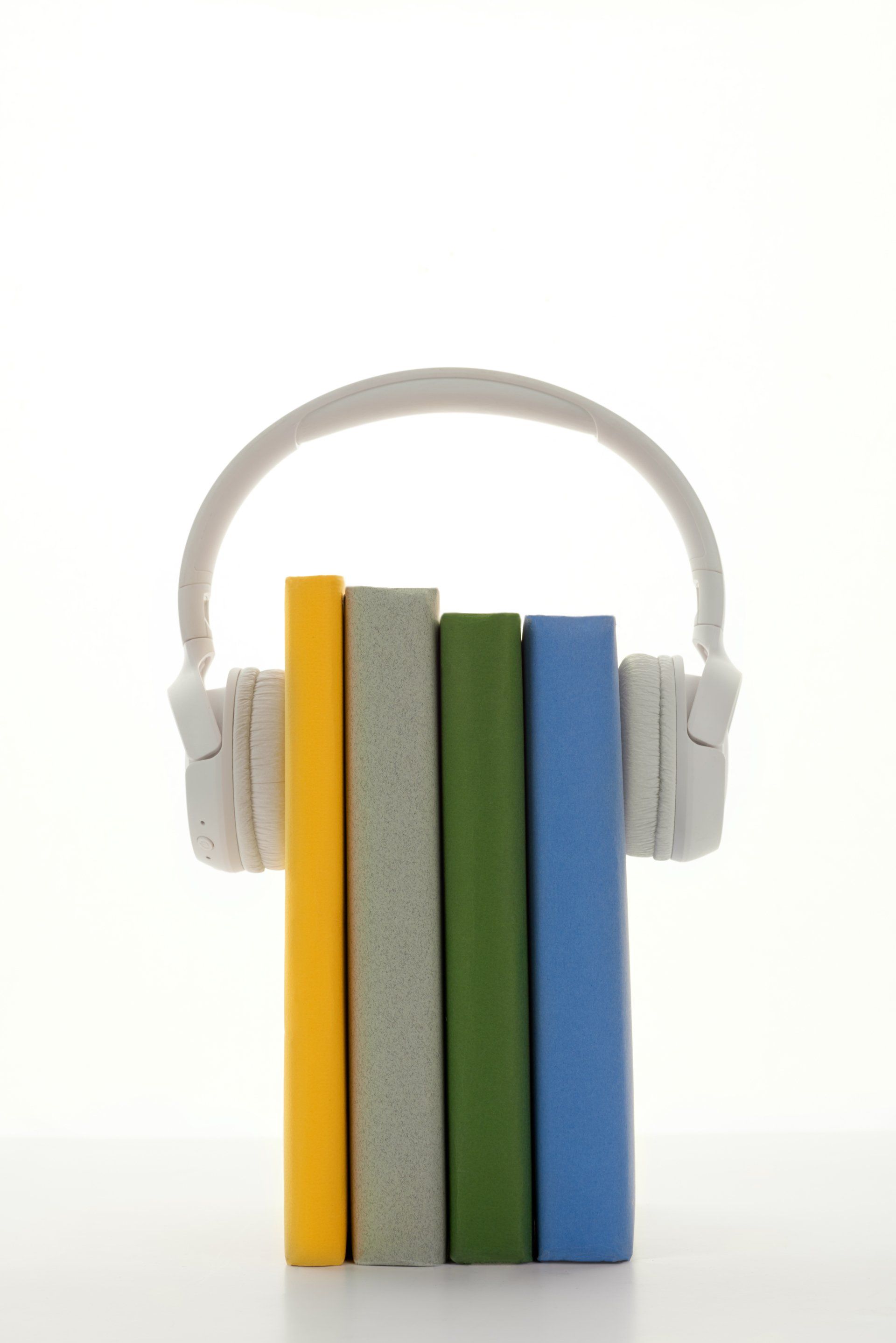 A stack of books with headphones attached to them