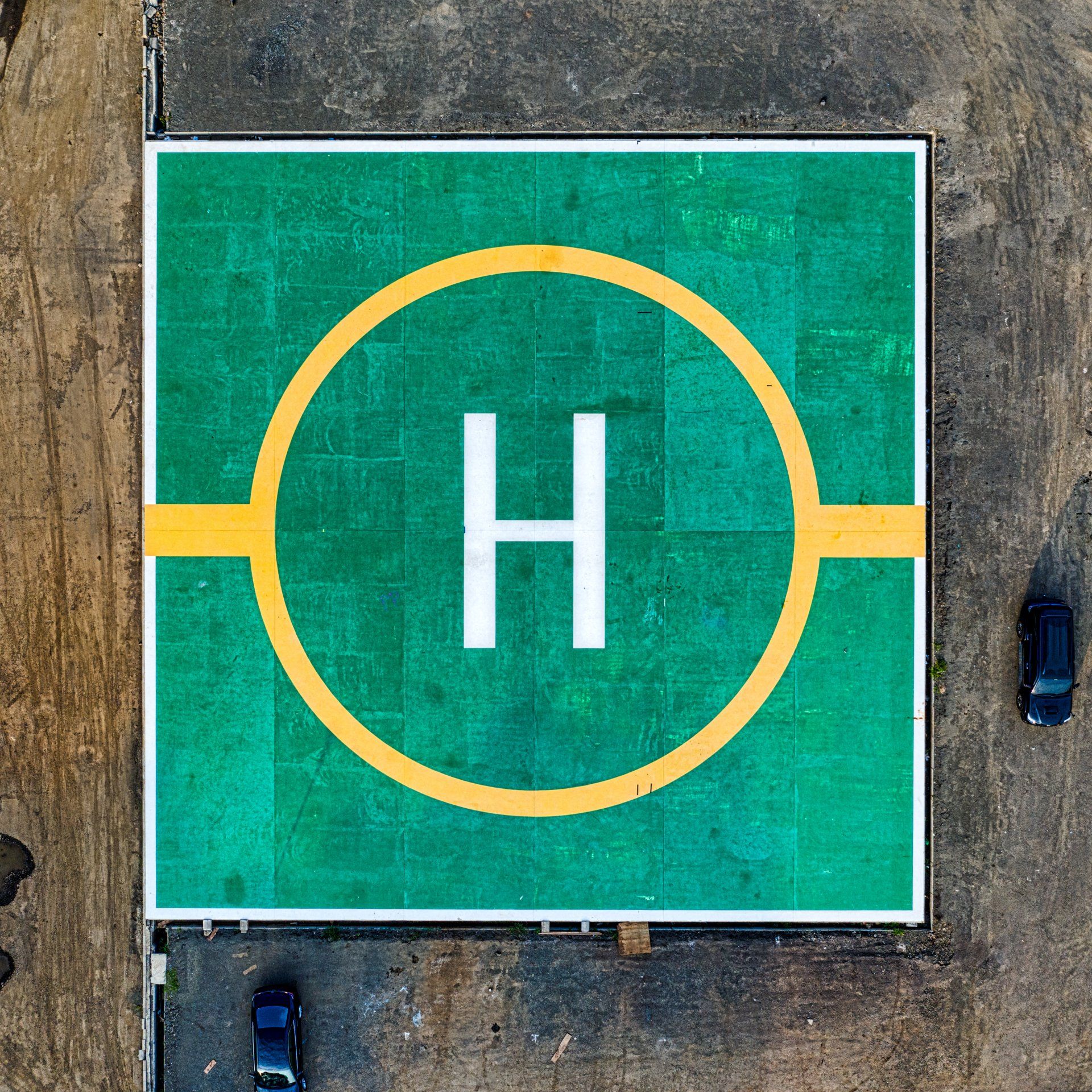An elevated helipad with a clearly marked landing area.