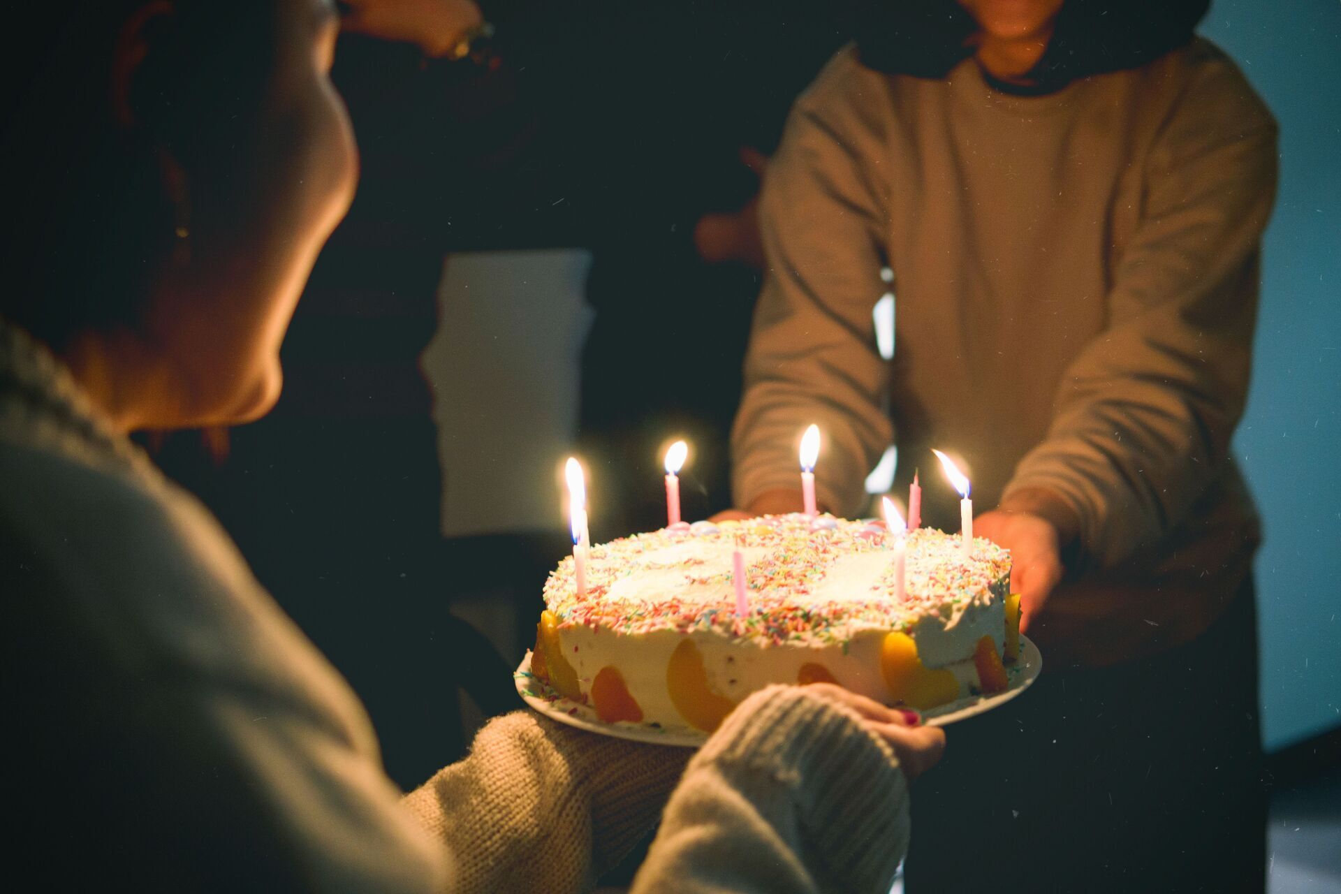 person holding a birthday cake