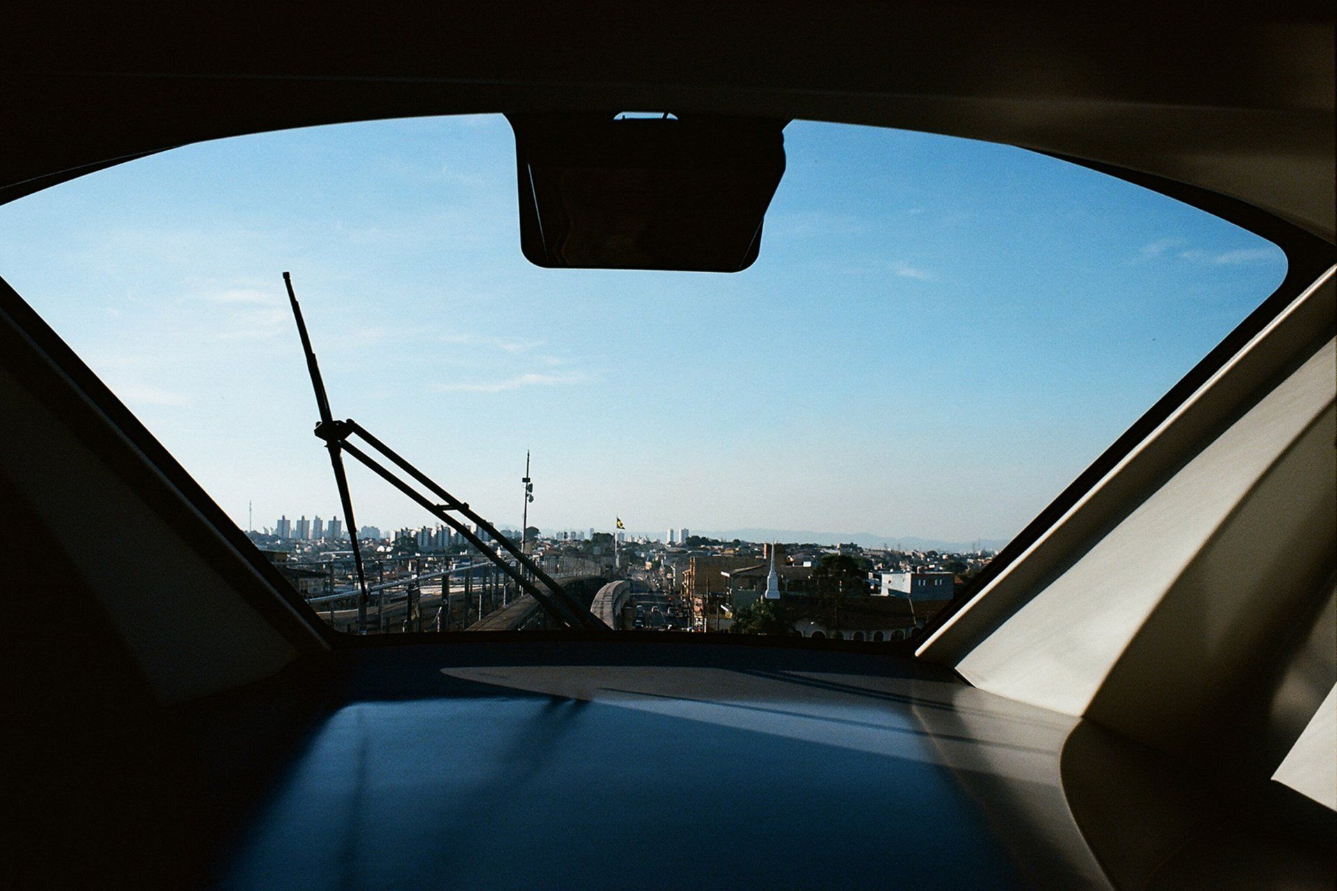 A view of a city through the windshield of a car  | Desert Car Care