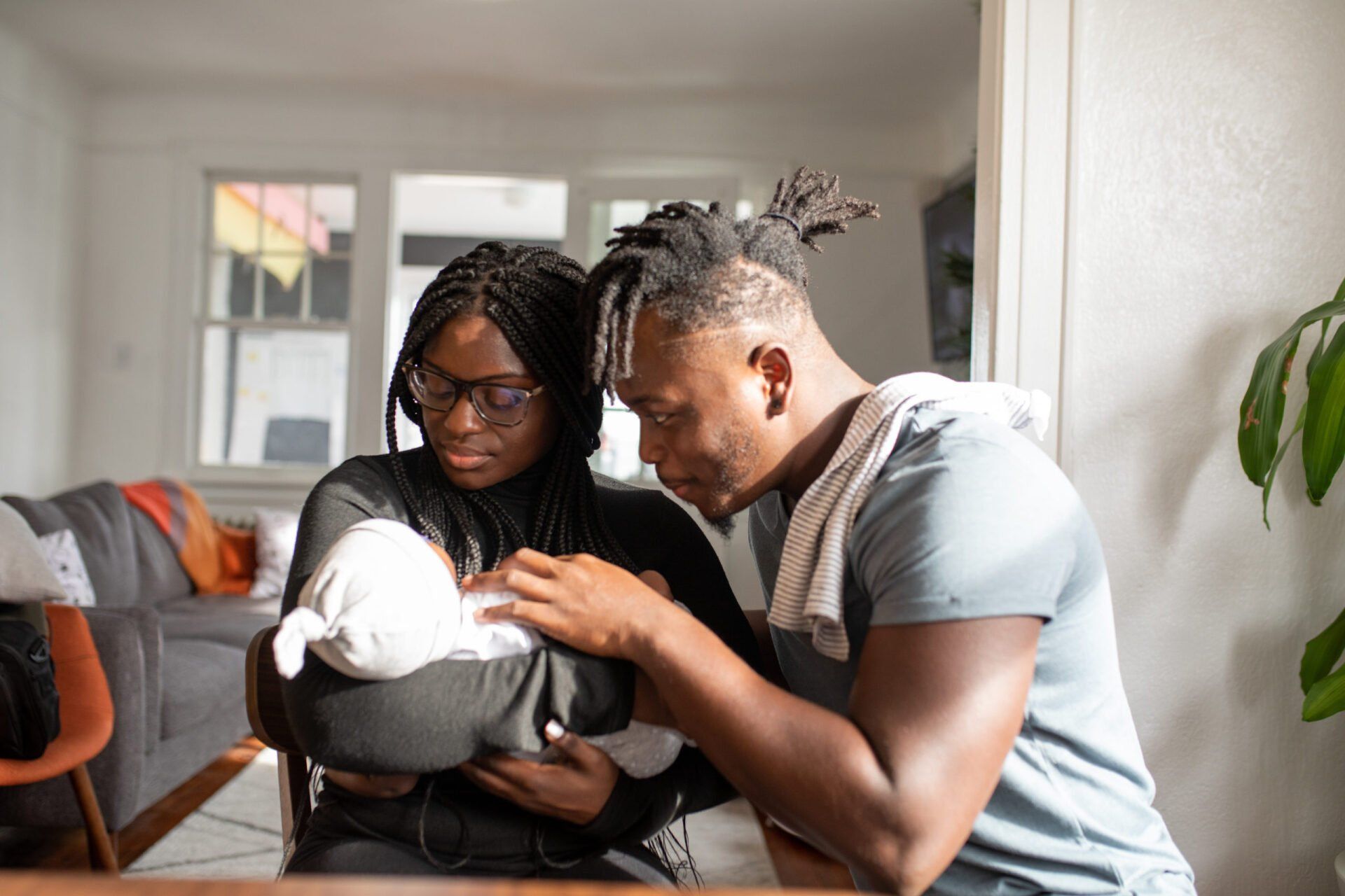 black family with newborn baby
