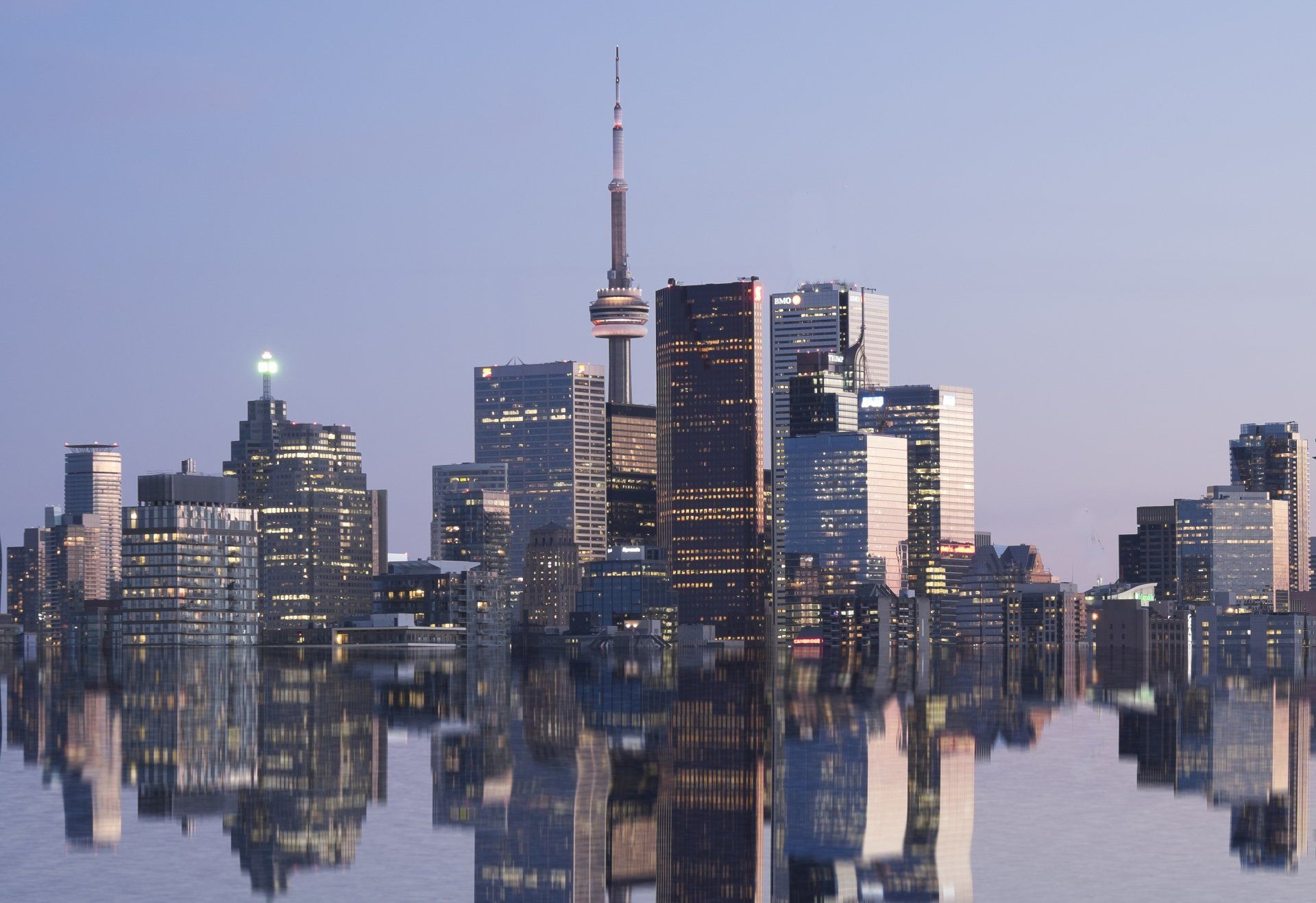 A large body of water with a tall building in the background