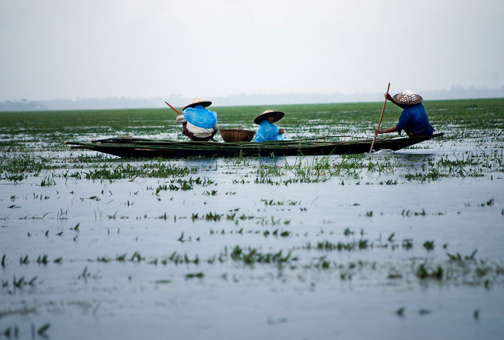 Two people are in a small boat in the water