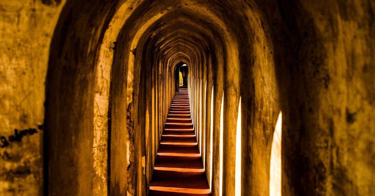 A long tunnel with stairs leading to the end of it.