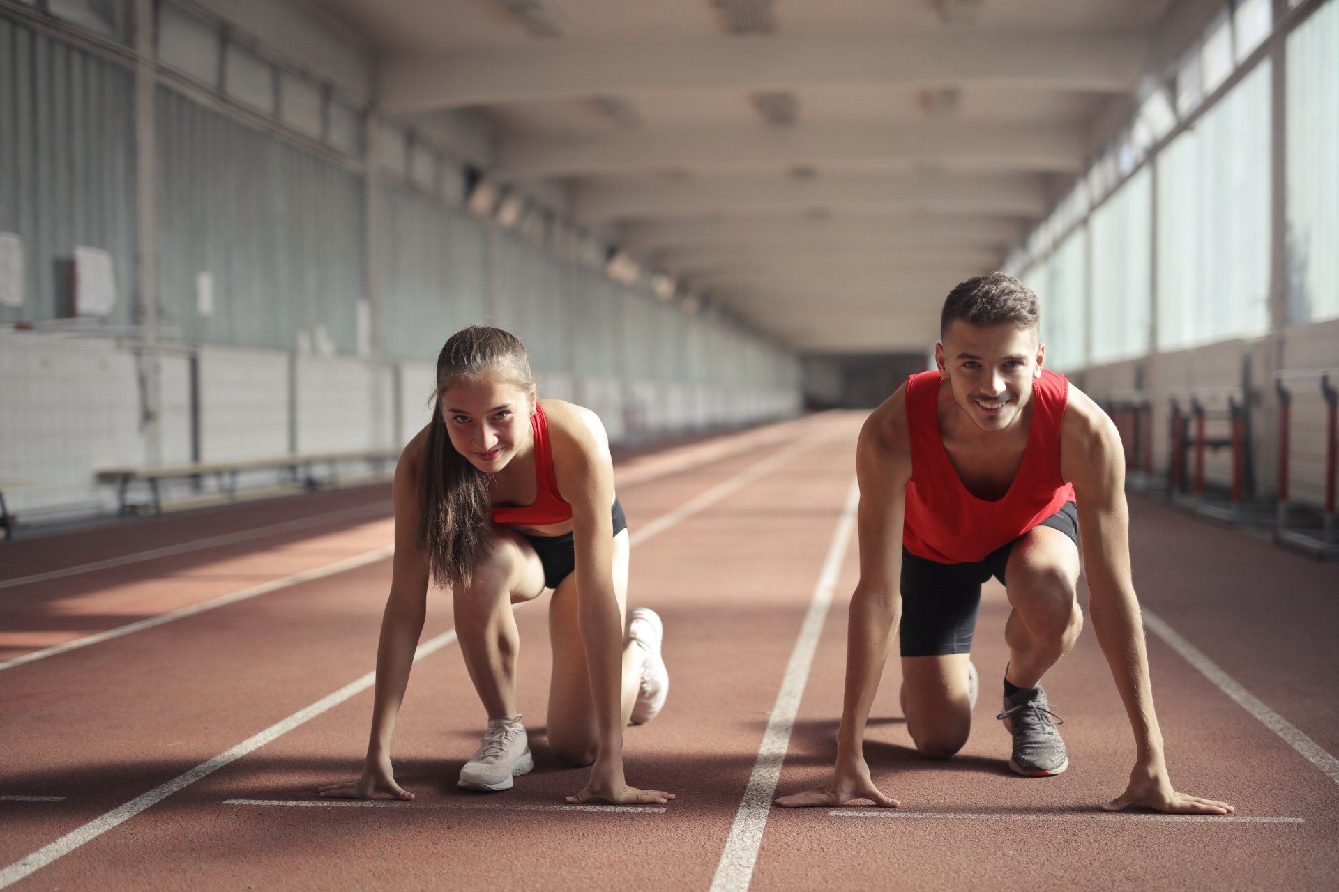 woman and man getting ready to run to unlock peak performance in personal training