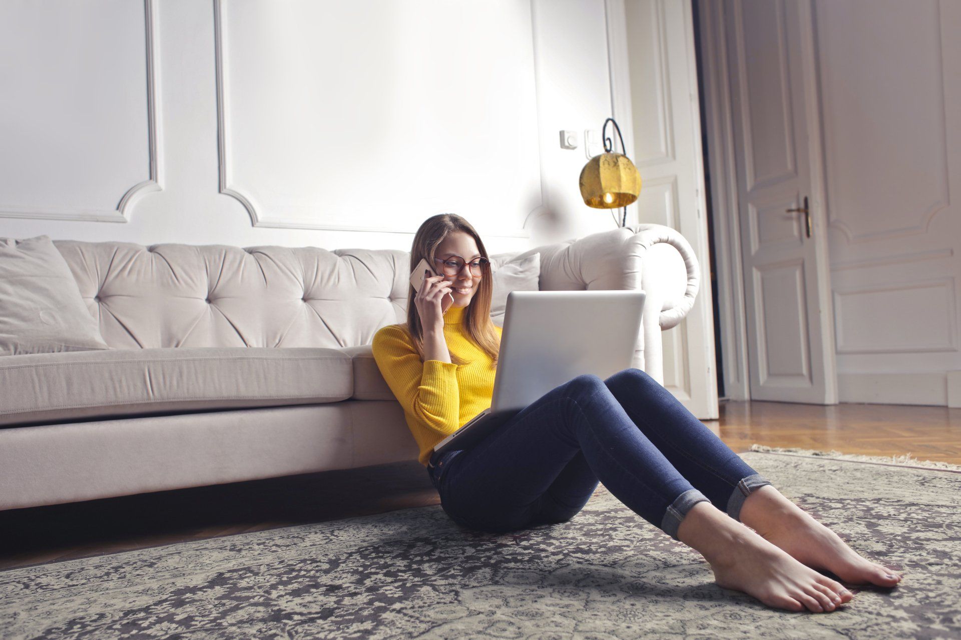 a woman sitting on a carpet