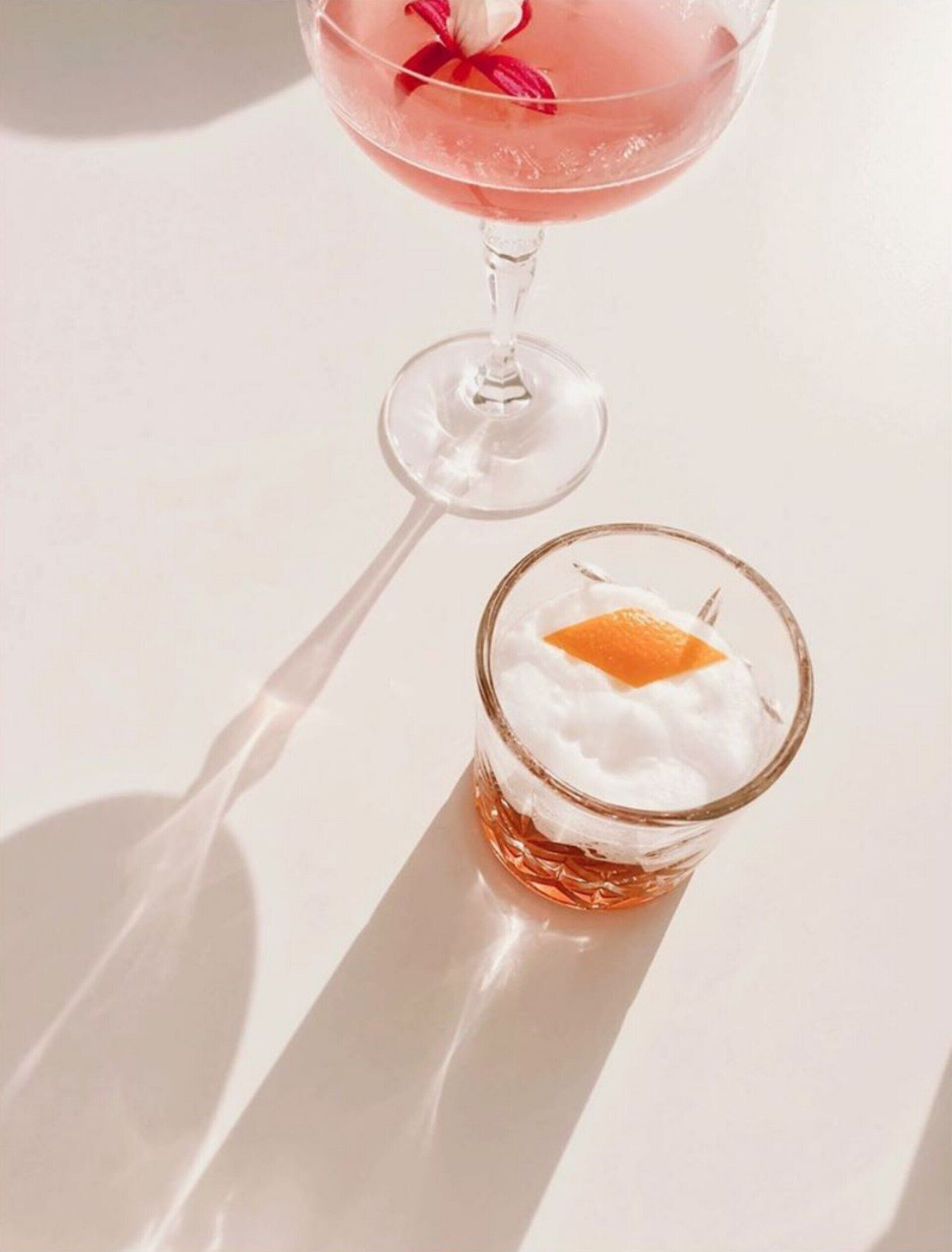 A close up of two drinks on a table