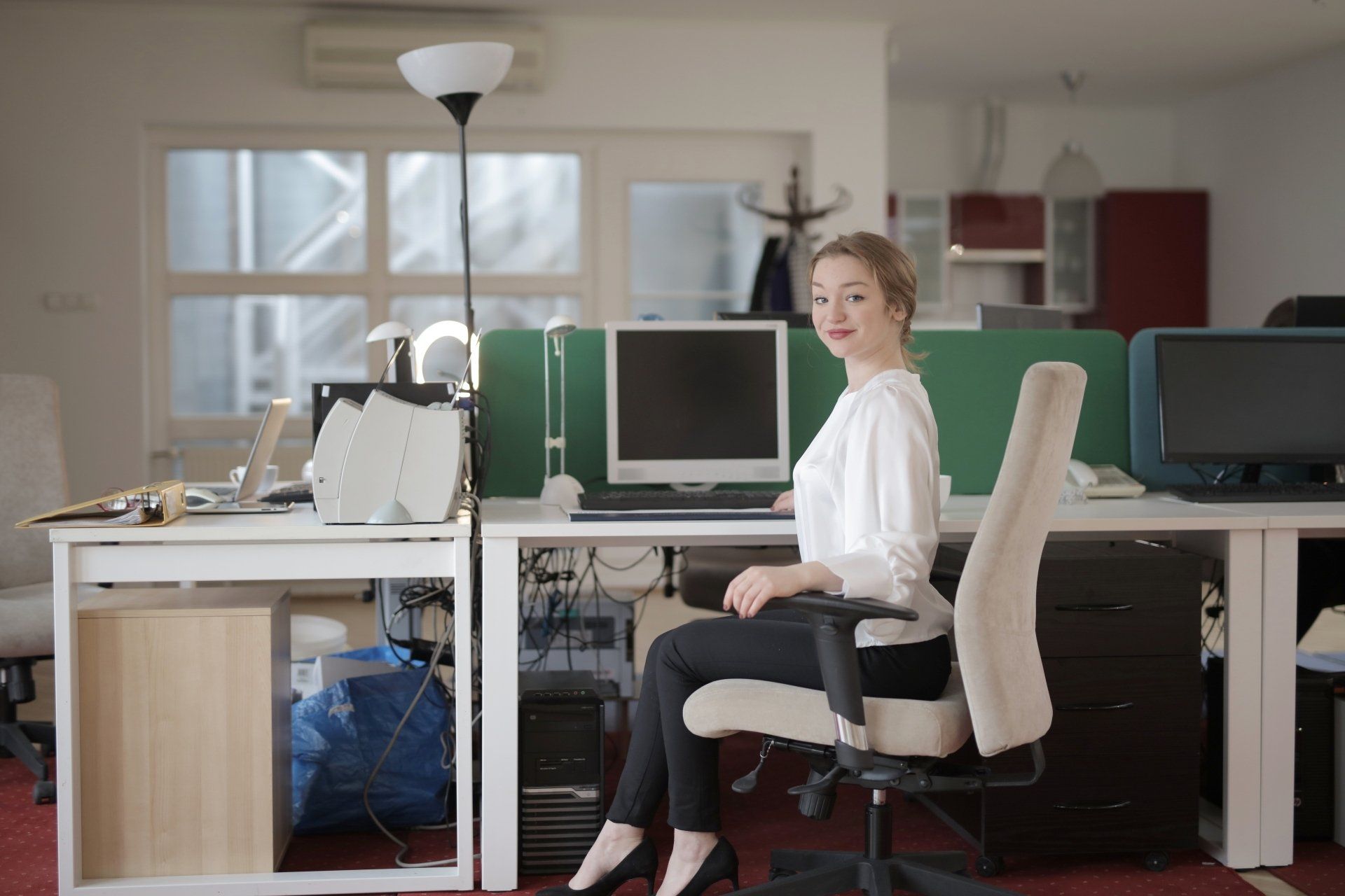 a virtual assistant sitting at a desk