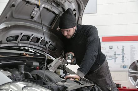 Mechanic inspecting engine