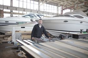 Boat Building Image with Worker