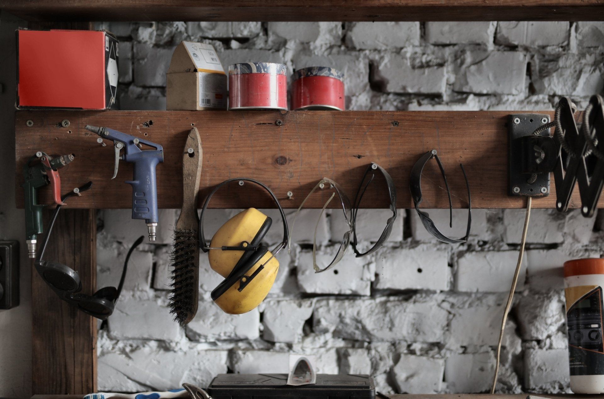 A work bench with tools in a brick garage