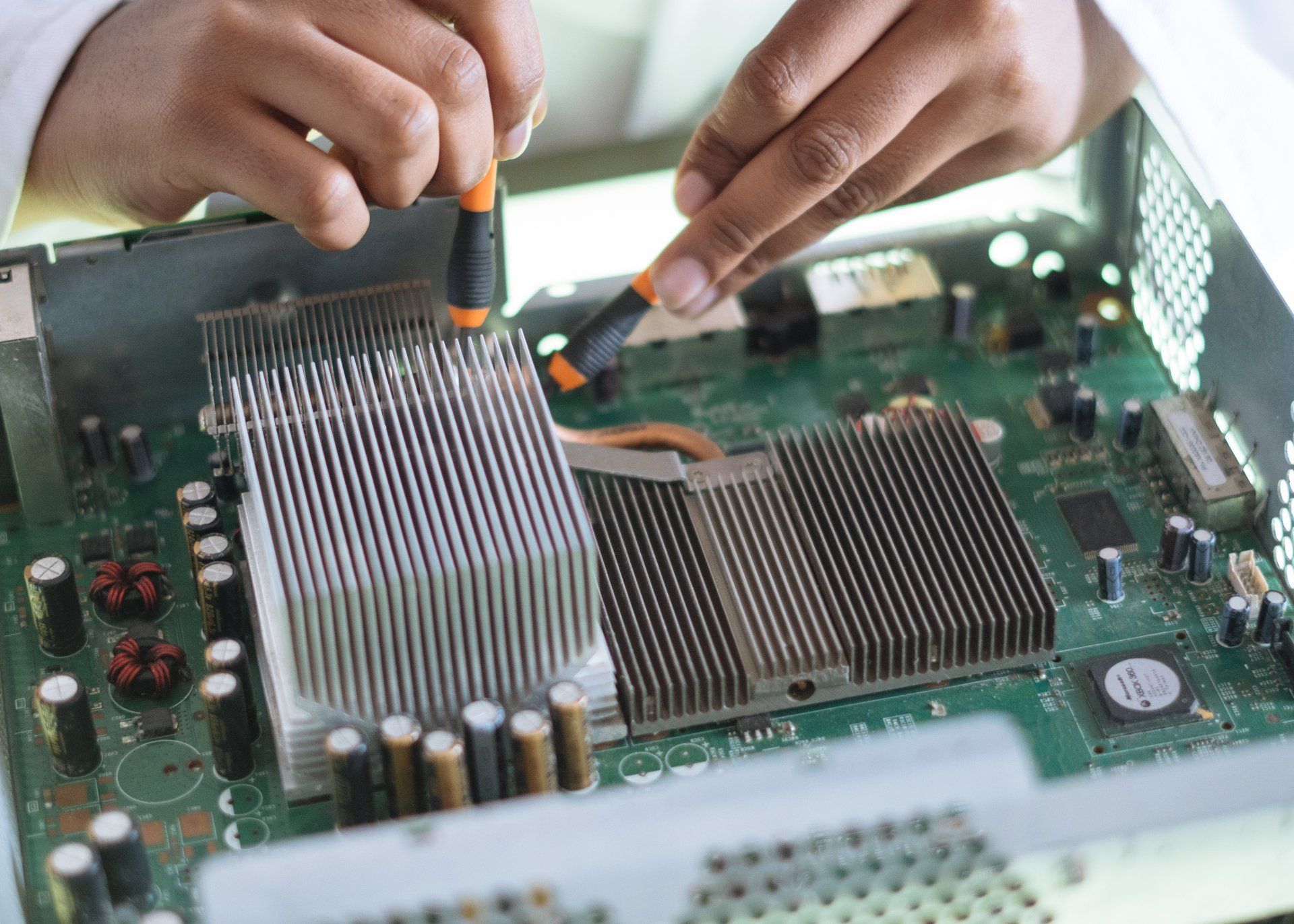 Computer repair technician diagnosing hardware issues