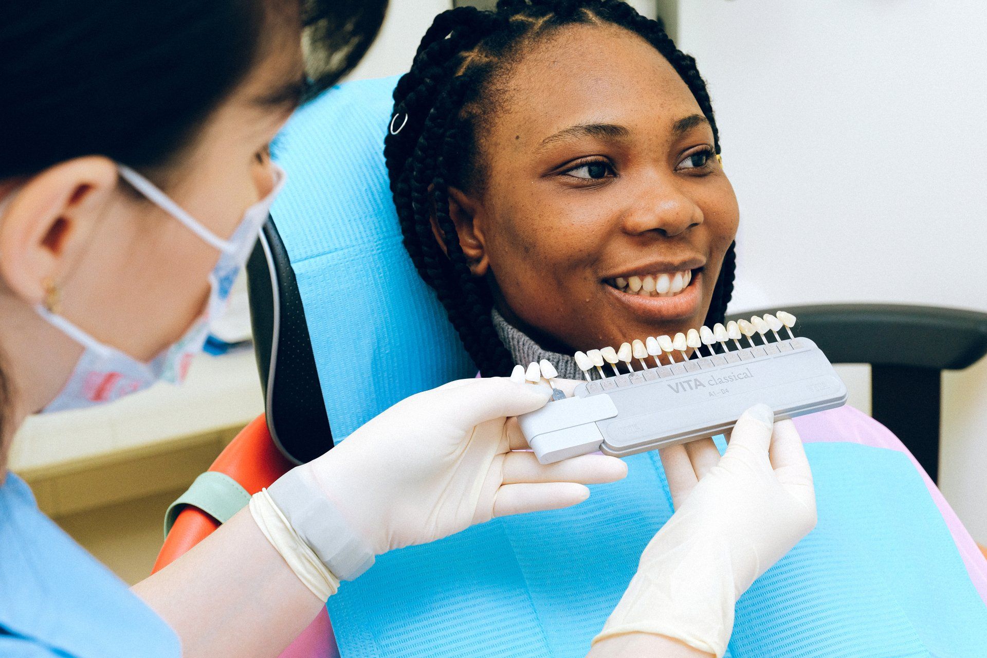 Woman at dentist getting dental implants | Birmingham MI 48009 and Dearborn, MI 48128