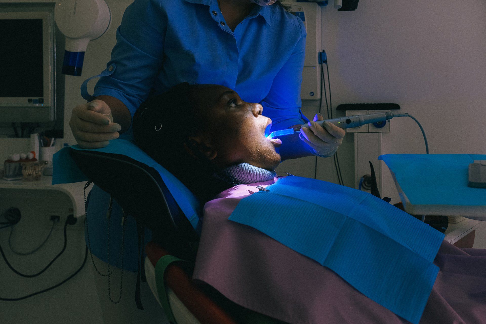 Patient undergoing dental soft laser procedure