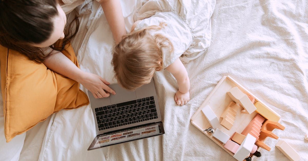 image of mom and baby on a computer while mom works on her business's website