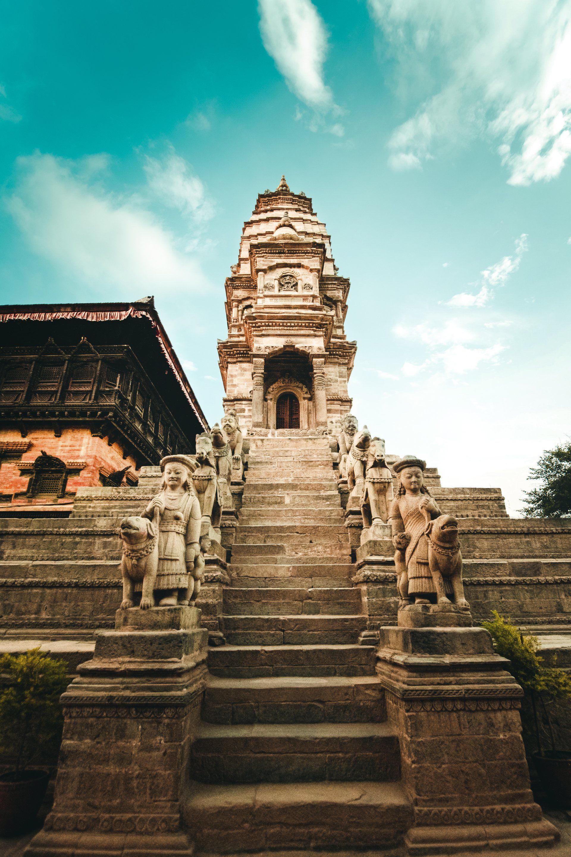 A very old temple with stairs leading up to it.