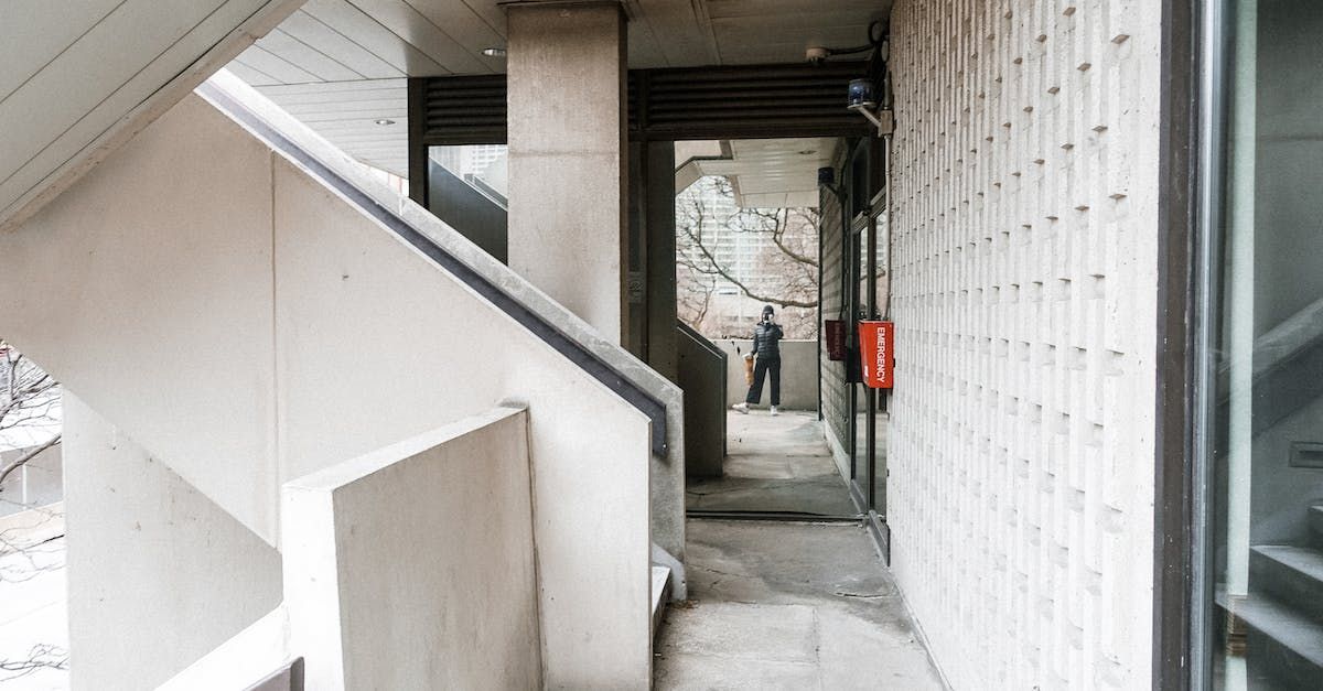 Stairs with a small entry nearby, leading to a crawl space visualizing the design of crawl space encapsulation