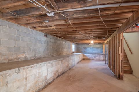 Image of a basement/crawl space under a house. Depicting crawl space repair.