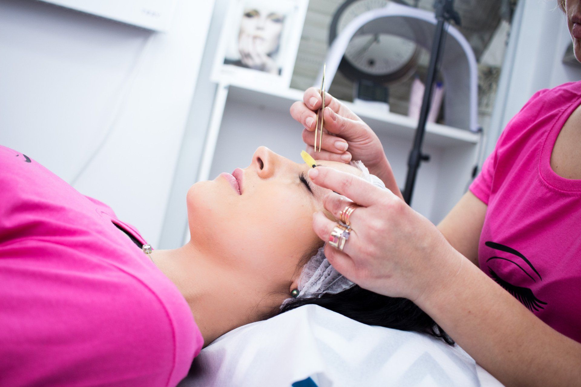 a woman is getting a facial treatment at a beauty salon .