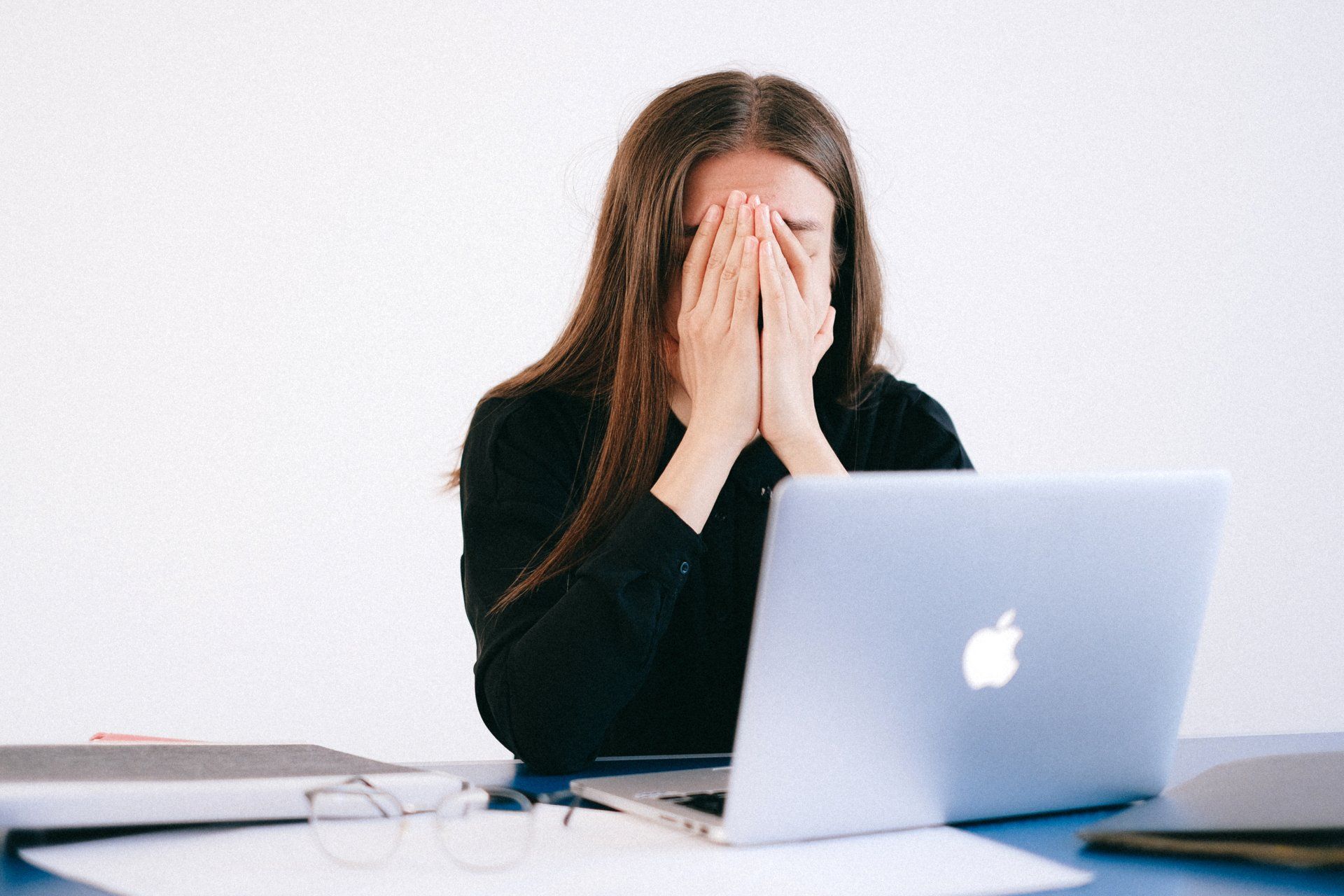 woman is stressed over computer