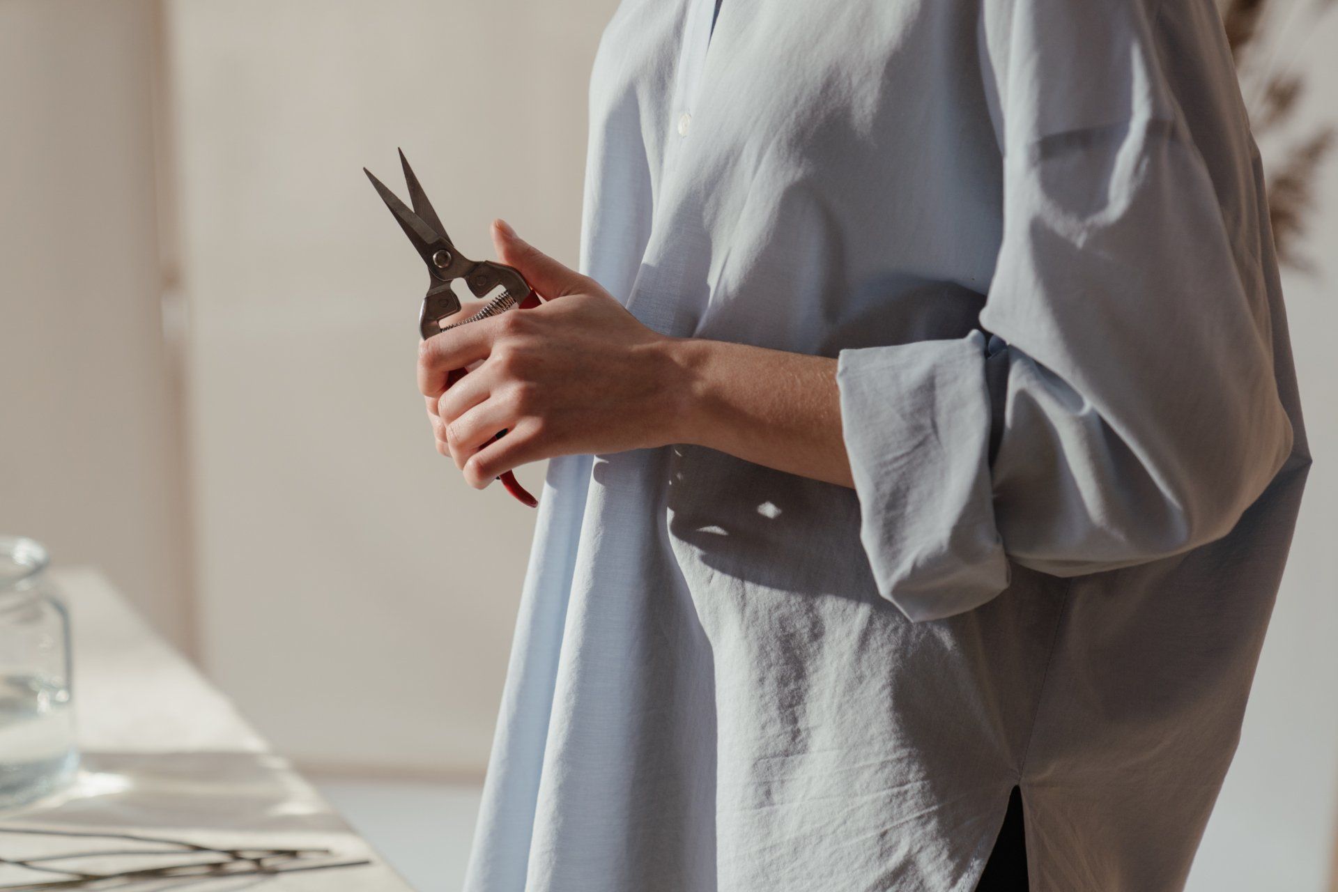 a person holding a pruning tool