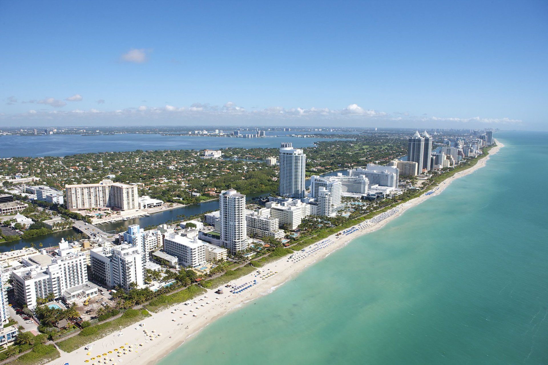 An aerial view of a city and a beach in miami florida.