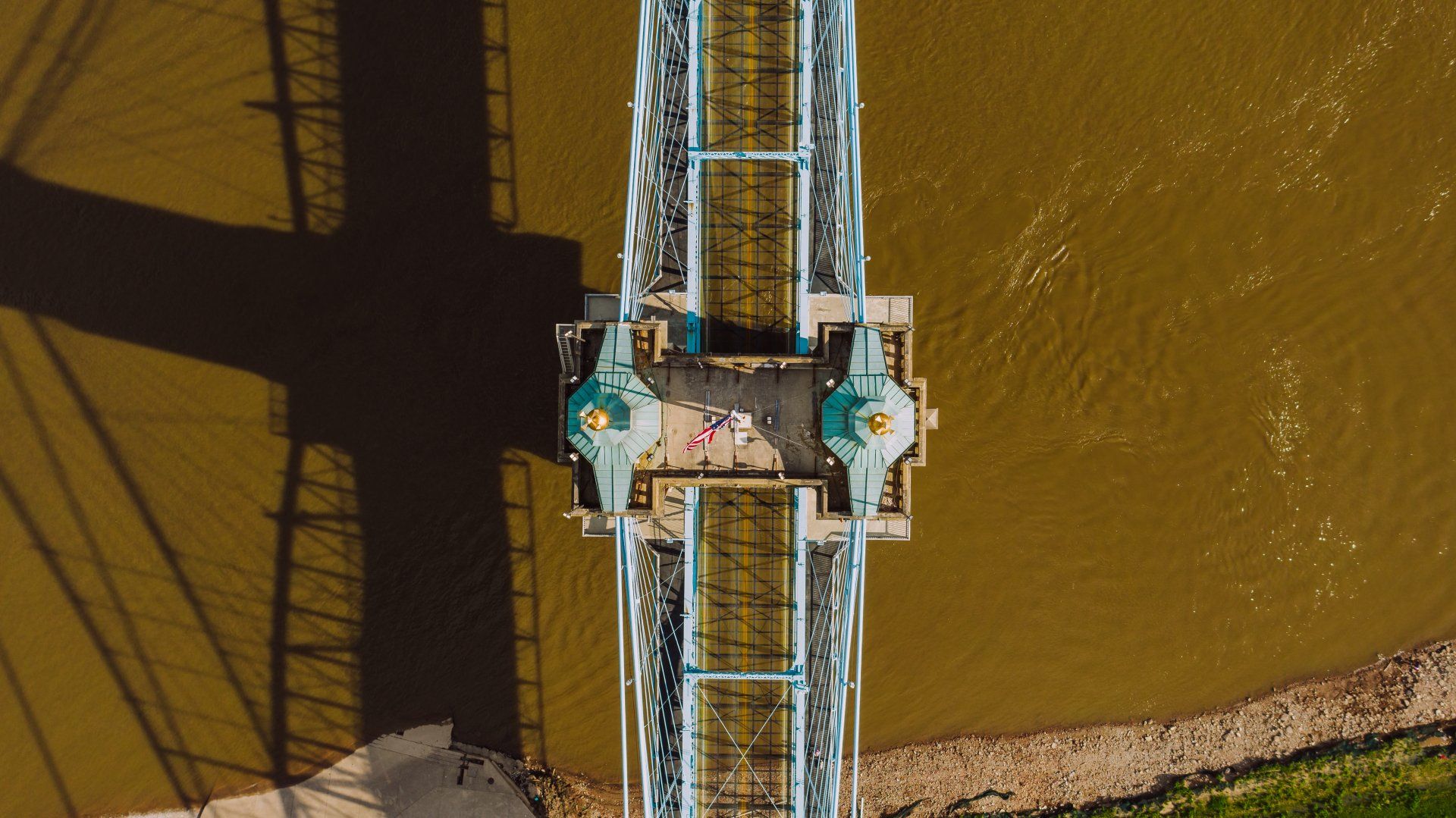 An aerial view of a bridge over a body of water.