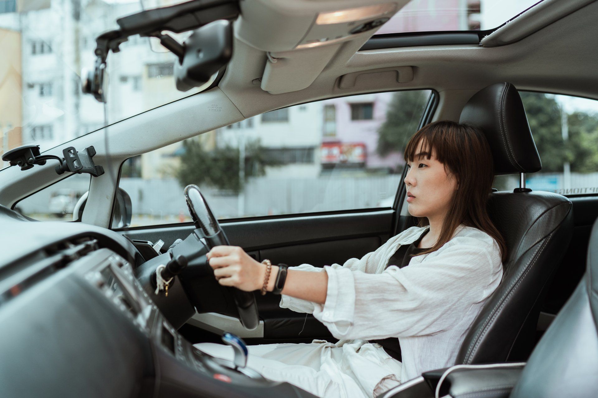 Woman driving for business purposes while tracking mileage