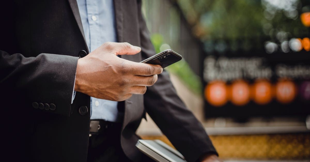 Business man holding cell phone